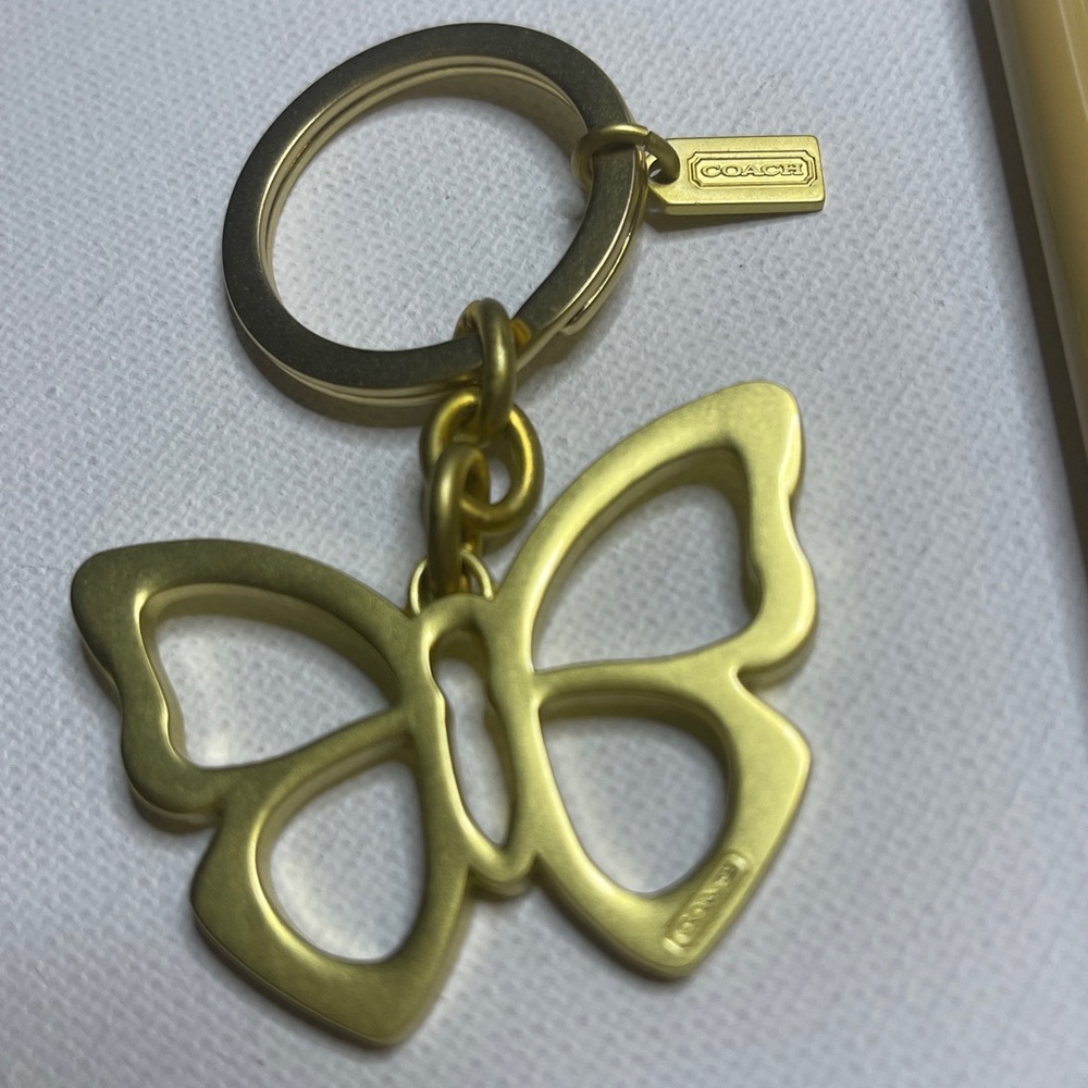 Coach Gold Butterfly Keychain and Cream Coach Pen - Picture 2 of 5